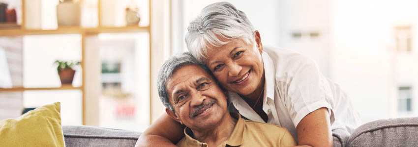 two older adults embracing
